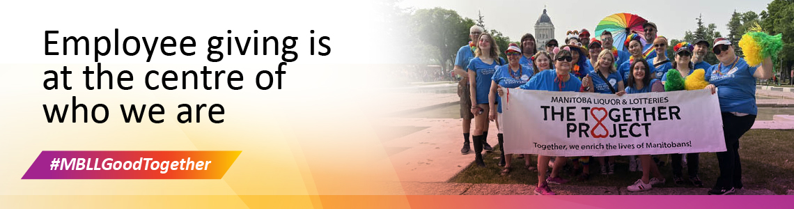Employee group holding a banner at an event