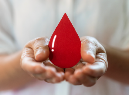 hands holding a drop