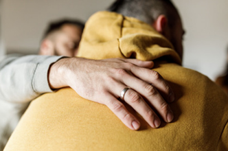 A support worker comforting a person.