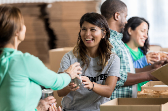 Woman smiling while volunteering at an event